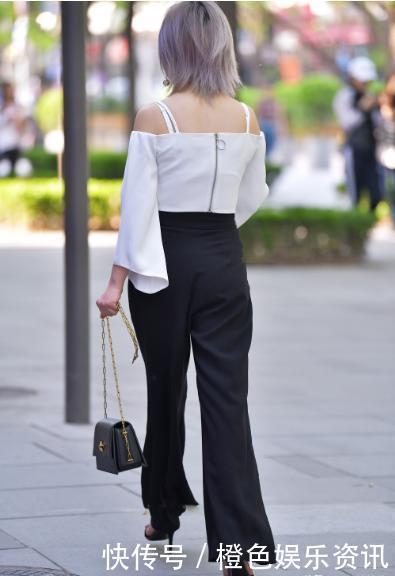 白色露肩吊带搭配黑色阔腿裤,简单大方,气场十足