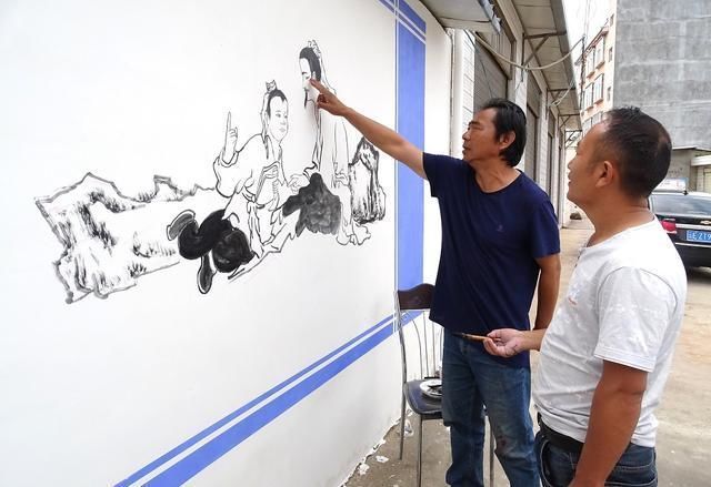 张建军!南华8名画家书法家手绘壁画 助力文明城市创建