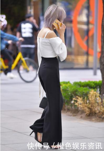 白色露肩吊带搭配黑色阔腿裤,简单大方,气场十足