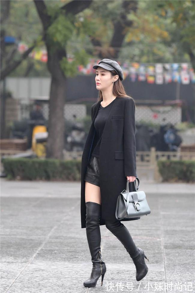 皮裤 黑色细高跟过膝长靴,修身款式,搭配黑色风衣,时尚抢眼