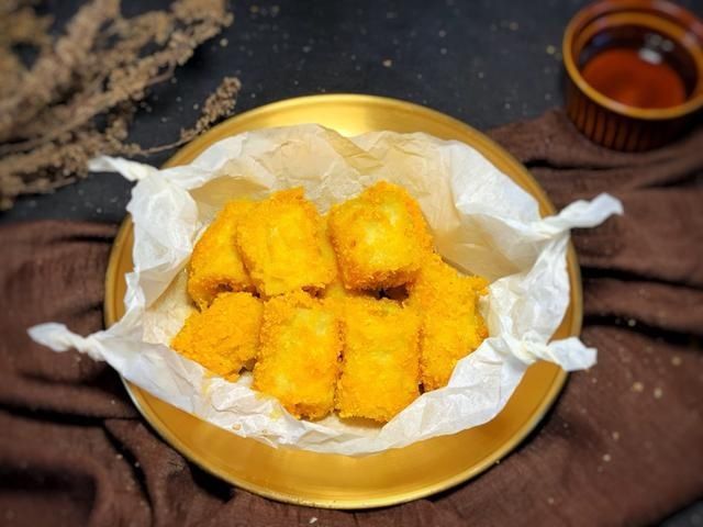 香蕉段|香蕉别直接吃，加1个鸡蛋换个做法，外酥里嫩，儿子当零食吃