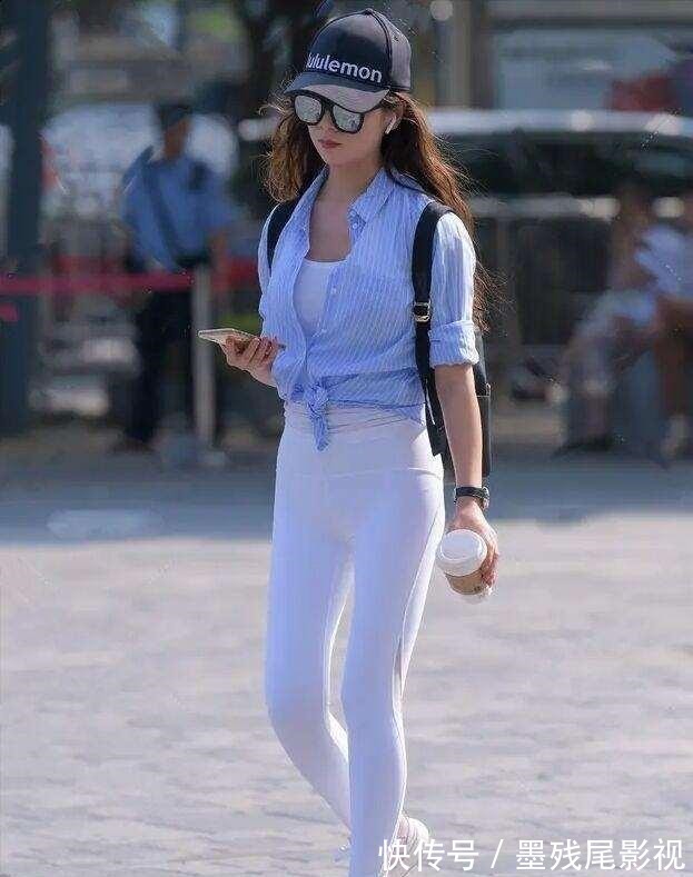 时尚靓丽 粉红色紧身打底裤搭配黑色运动帽,时尚靓丽,体现迷人的小腿!