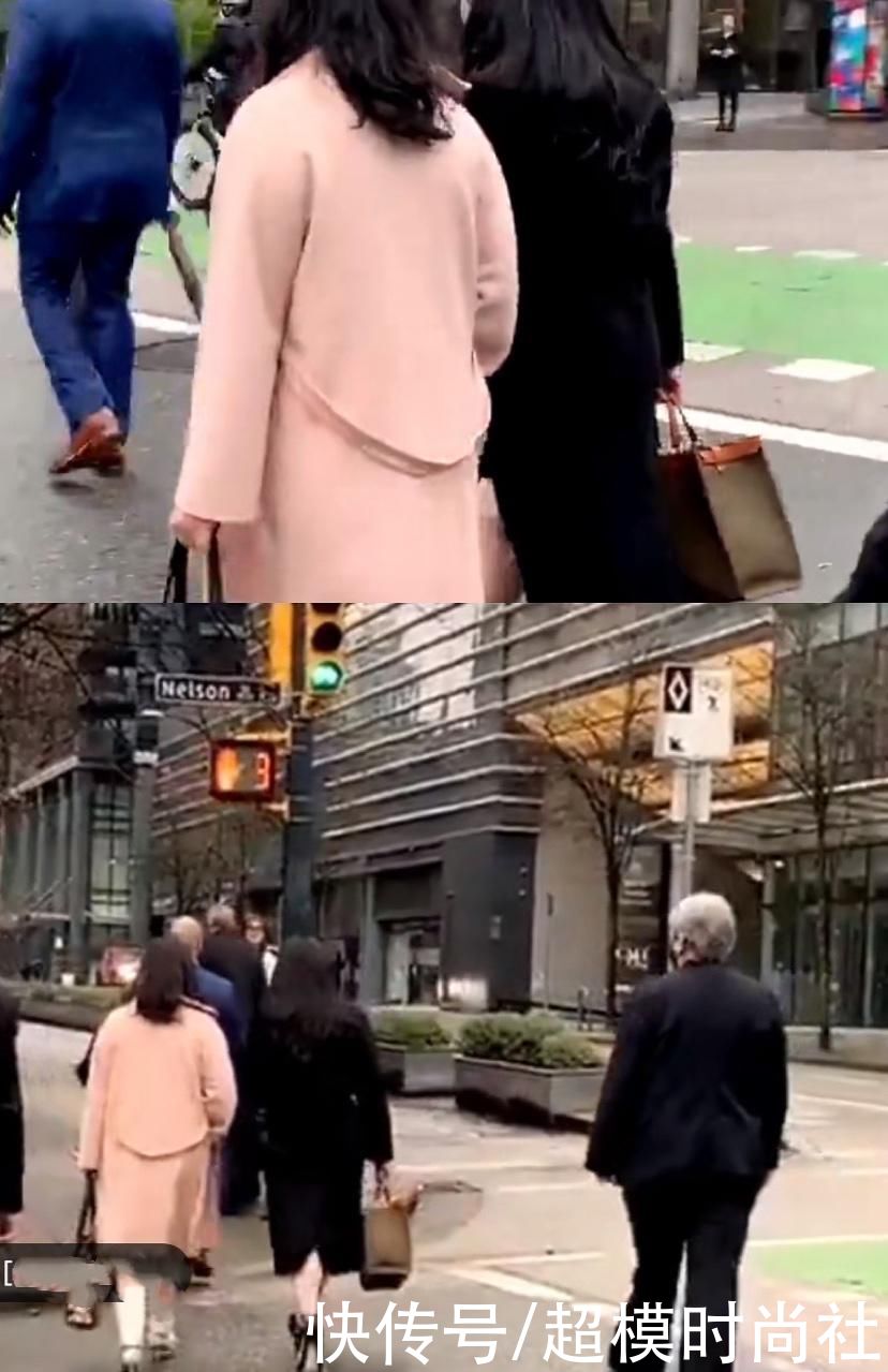 孟晚舟穿黑色大衣低调现身，戴钻石烟火胸针，气场变得自信张扬