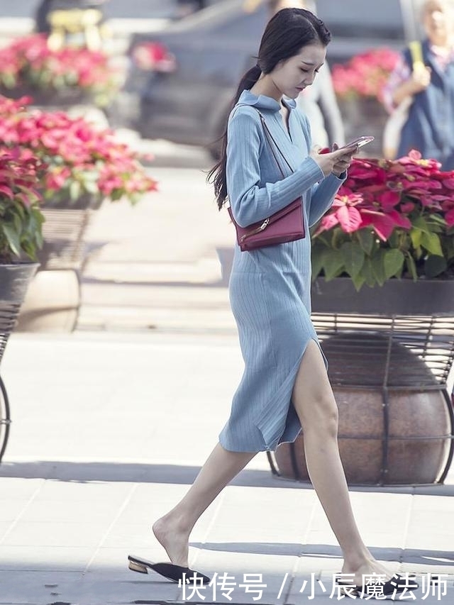 路人街拍，靓女穿小V领的黑色上衣，尽显休闲的时髦范