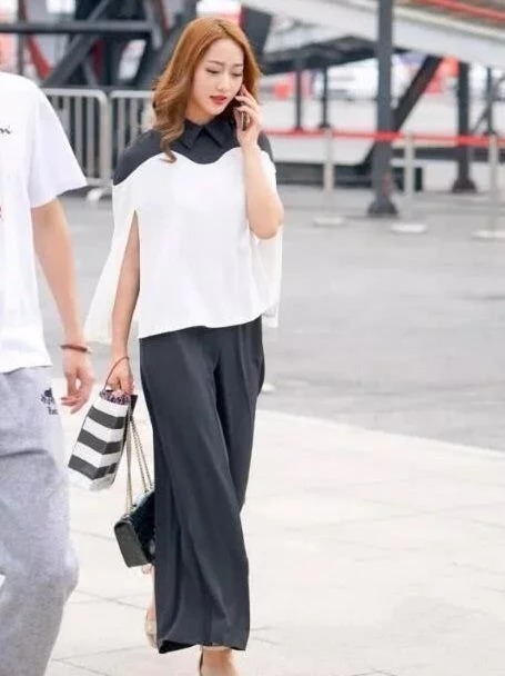 街拍:美女身穿个性上衣,时尚又亮丽,尽显高贵气质