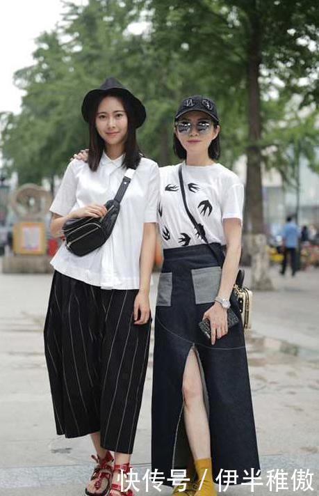 街拍小姐姐身材小巧精致，吊带裙搭配高跟鞋，背影小鸟依人