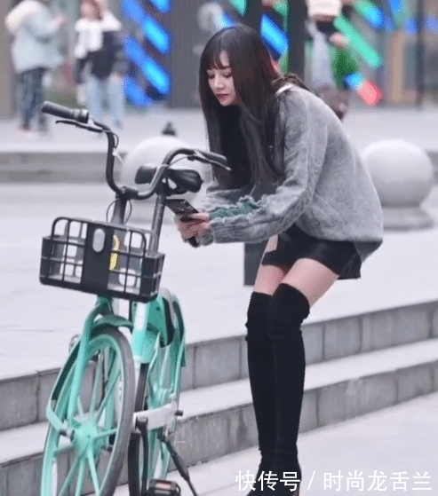 骑自行车 实在想不明白,穿长筒高跟鞋怎么骑车?也不怕摔跤吗?