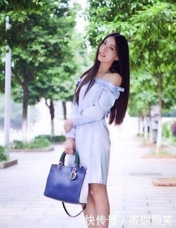 街拍:淡黄色秀发,美女轻微的侧着身子,看起来惊艳无比