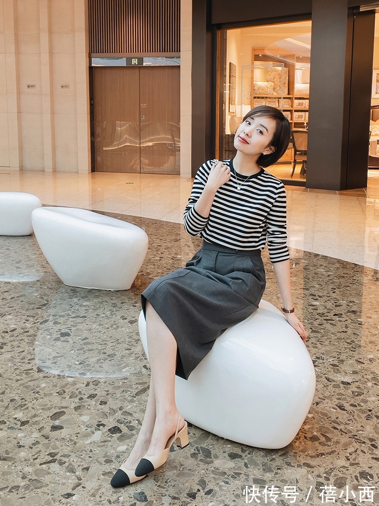 搭配 早春穿裙子流行“过膝不过踝”,配西装、风衣都挺美,打造时髦感