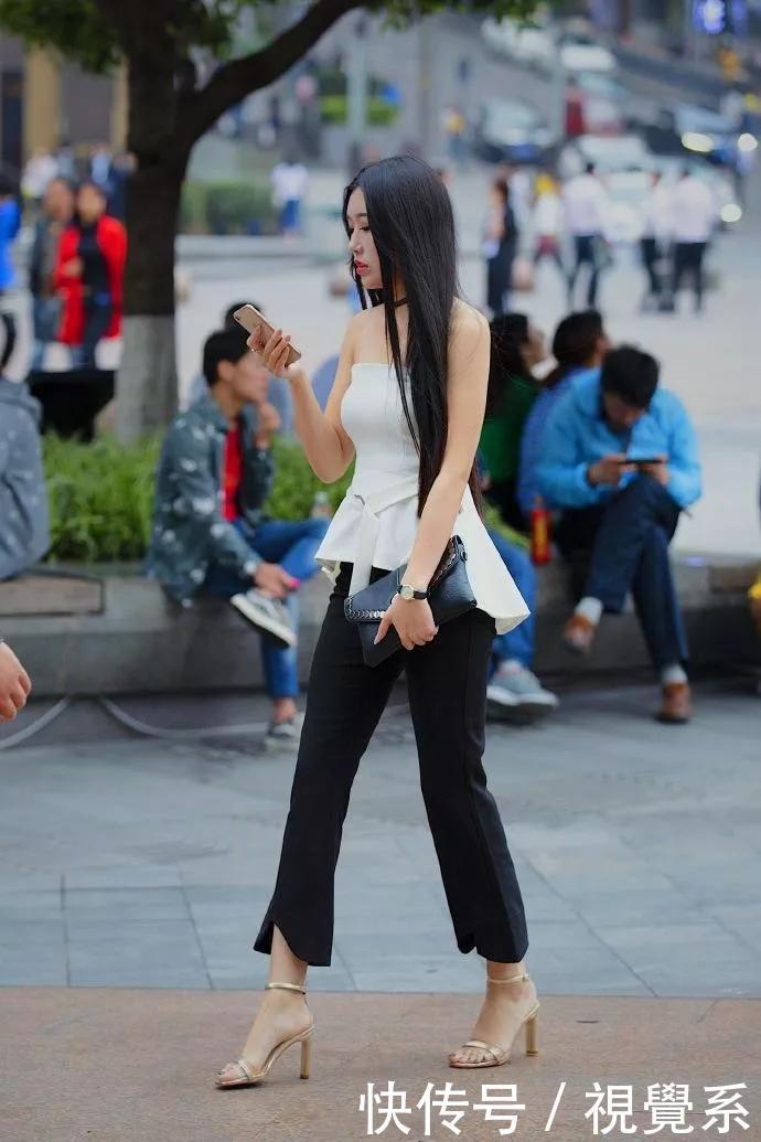小姐姐脚上穿搭上一双尖头的黑色高跟鞋,走在路上就是一道风景