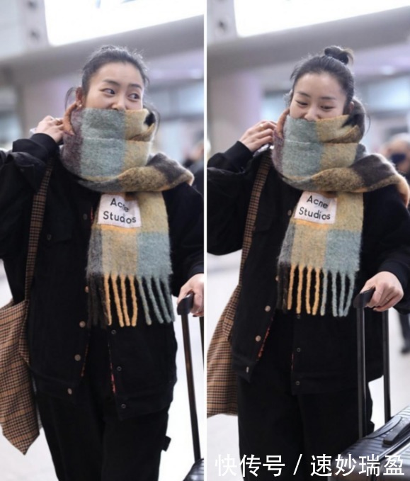 刘雯穿一身黑,配上拼色围巾,将头发盘起来干净利落又保暖