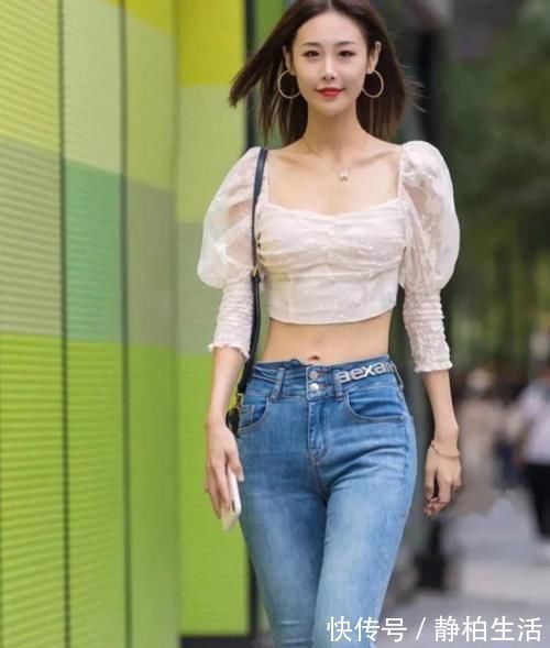 牛仔 美女模特:蓝色牛仔裤展现出漂亮的小蛮腰,美女太可爱了