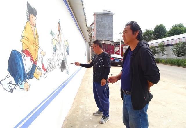 张建军!南华8名画家书法家手绘壁画 助力文明城市创建