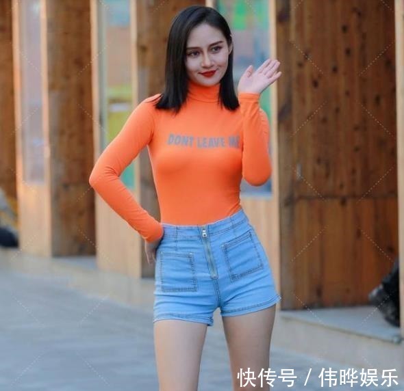 上衣 时尚穿搭:亮橙色上衣搭配牛仔短裤,美女真是不怕冷啊