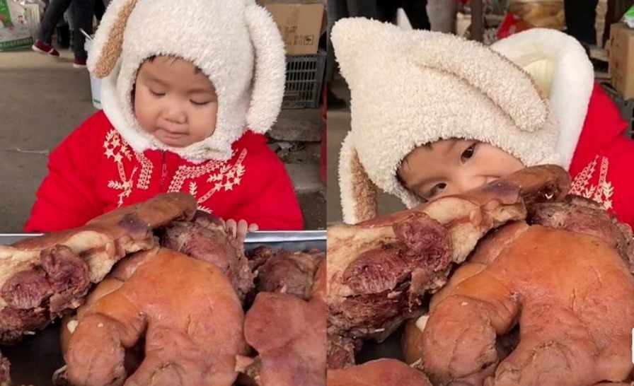 家长|“贪吃宝宝”走红,菜市场偷啃猪头肉和腊肠,老板看见却笑得不行