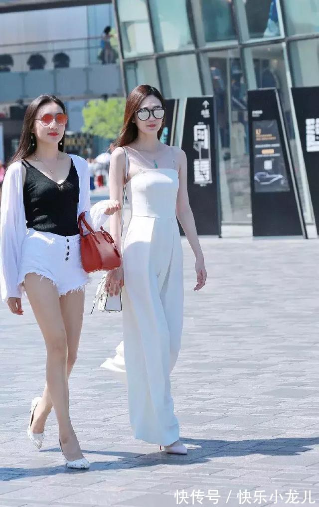 连衣裙 粉红色的吊带连衣裙,在裙子的腰部,采用收腰与镂空的设计