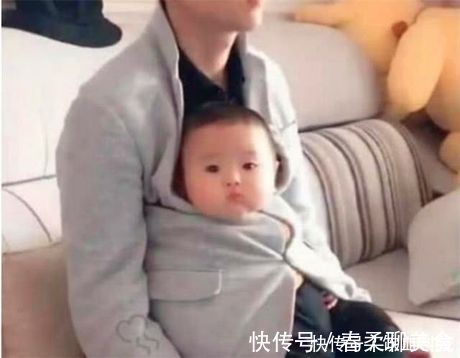 宝爸|又一位宝爸因独特的抱娃姿势火了,网友爸爸带娃,活着就行