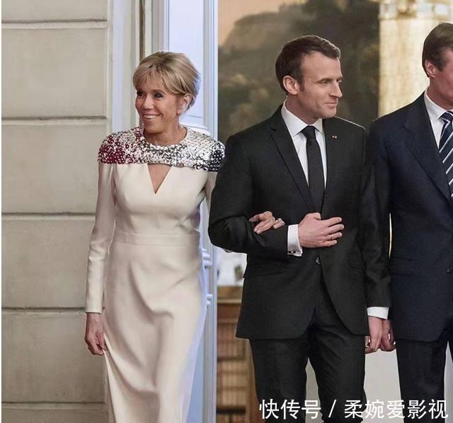 布丽吉特换新发型好年轻!手挽老公气质高贵,穿风衣露小腿美翻了