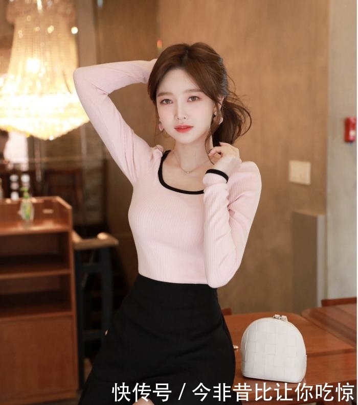 黑色高腰短裙,裙摆处不规则设计,个性时尚